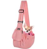 SlowTon Dog Carrier Sling in pink, featuring an adjustable padded shoulder strap and hard bottom support, designed for small dogs and cats with safety hooks and storage pockets